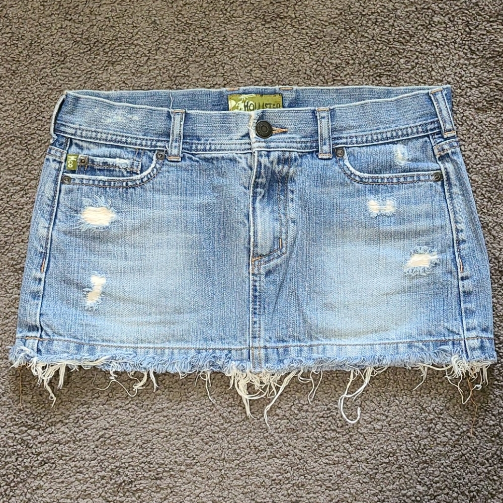 Distressed denim mini skirt